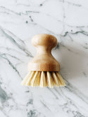 100% Compostable Pot Scrubber with natural sisal bristles and beechwood handle for plastic-free kitchen and household cleaning.