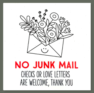 A sticker with a cartoon illustration of a mailbox filled with flowers and the text 'NO JUNK MAIL' in red. The background is plain white.